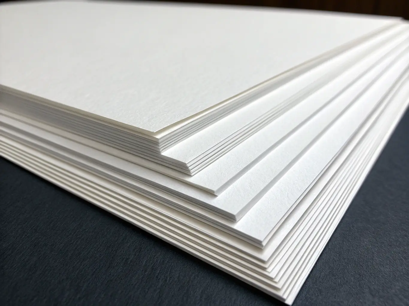 A high-resolution image of bleached hardwood pulp sheets showcasing their bright white color and fine texture, used to represent the product offering on TrueNorth Tradelinks Ltd's website.